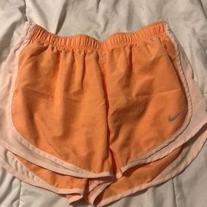 Orange Nike shorts. Size medium